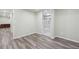 Basement area with fresh paint, LVP flooring, and view of a modern bathroom at 4321 W 118Th Pl, Westminster, CO 80031