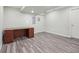 Finished basement area featuring modern flooring and classic work desk at 4321 W 118Th Pl, Westminster, CO 80031