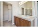 Double vanity bathroom with a walk-in closet at 4321 W 118Th Pl, Westminster, CO 80031