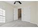 Bright bedroom with neutral carpet, ceiling fan, and white doors at 4321 W 118Th Pl, Westminster, CO 80031