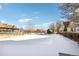 Snow-covered community pool area with surrounding buildings at 4321 W 118Th Pl, Westminster, CO 80031