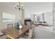 Virtually staged dining room, open concept with living room and fireplace at 4321 W 118Th Pl, Westminster, CO 80031