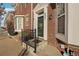 Townhome's front entrance with a brick exterior and black railing at 4321 W 118Th Pl, Westminster, CO 80031