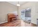 Cozy living room with hardwood floors, sliding glass doors and a classic upright piano at 4321 W 118Th Pl, Westminster, CO 80031