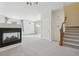 Open floor plan featuring a fireplace, staircase, and bright entryway for a welcoming home at 4321 W 118Th Pl, Westminster, CO 80031