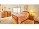 Bedroom with a cozy bed, dresser, and ample natural light from the large window at 6126 S Pierson St, Littleton, CO 80127