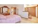 Comfortable bedroom leading to the bathroom and offering plenty of closet space and a vanity area at 6126 S Pierson St, Littleton, CO 80127