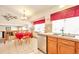 Open dining area featuring a table set for four with adjacent kitchen features at 6126 S Pierson St, Littleton, CO 80127