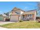 Charming two-story home featuring a well-maintained lawn, two car garage, and welcoming front porch at 6126 S Pierson St, Littleton, CO 80127