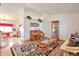 Bright living room features hardwood floors, vaulted ceilings, and open layout to kitchen at 6126 S Pierson St, Littleton, CO 80127