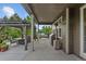 Inviting back patio with an outdoor kitchen, dining area, and a cozy seating area with a swing at 7408 Sodalite Way, Castle Rock, CO 80108