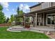 Beautiful backyard with a pergola-covered patio, an outdoor grill, and a lush lawn at 7408 Sodalite Way, Castle Rock, CO 80108