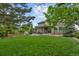 Lush backyard with a pergola-covered patio, perfect for outdoor entertaining at 7408 Sodalite Way, Castle Rock, CO 80108