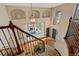 Grand foyer with high ceilings, a curved staircase, and a view into the living room at 7408 Sodalite Way, Castle Rock, CO 80108