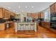Spacious kitchen with custom cabinets, granite counters, island with seating and stainless appliances at 7408 Sodalite Way, Castle Rock, CO 80108