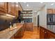 Close up of kitchen featuring custom cabinets, granite counters, and stainless appliances at 7408 Sodalite Way, Castle Rock, CO 80108