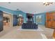 Bright and airy main bedroom showcasing a seating area, fireplace, and ample closet space at 7408 Sodalite Way, Castle Rock, CO 80108