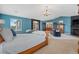 Large main bedroom with a cozy seating area and fireplace, perfect for relaxation at 7408 Sodalite Way, Castle Rock, CO 80108