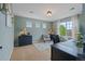 Home office featuring a desk, chair, and large windows with natural light at 7408 Sodalite Way, Castle Rock, CO 80108
