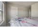 Bright bedroom featuring a floral bedspread with an open doorway visible from the side of the bed at 2790 Center Park Way, Berthoud, CO 80513