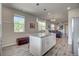 Spacious kitchen with a center island, stainless steel appliances, and seamless flow to the living area for easy entertaining at 2790 Center Park Way, Berthoud, CO 80513