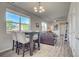 Bright living area with large windows, comfortable seating, and modern decor, creating a welcoming atmosphere at 2790 Center Park Way, Berthoud, CO 80513