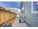 Cozy side yard shows private outdoor space with a wooden fence and gravel landscaping at 2790 Center Park Way, Berthoud, CO 80513