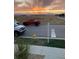 Street view with a fire hydrant, trucks, and a beautiful sunset over the mountains at 2790 Center Park Way, Berthoud, CO 80513