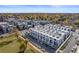 A picturesque aerial view of modern townhomes and vibrant fall foliage in a desirable neighborhood at 4244 E 8Th Pl, Denver, CO 80220