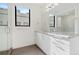 Bathroom with white vanity, granite countertop, and glass shower at 4244 E 8Th Pl, Denver, CO 80220