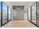 Bedroom with a wall of built-in storage and balcony access at 4244 E 8Th Pl, Denver, CO 80220