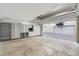 Bright garage featuring shelving and cabinets for ample storage opportunities at 4244 E 8Th Pl, Denver, CO 80220