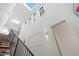 Modern staircase with skylights and black metal railing at 4244 E 8Th Pl, Denver, CO 80220