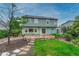 Spacious backyard featuring a stone patio, perfect for outdoor entertaining and relaxation at 123 Wheat Ridge St, Palmer Lake, CO 80133