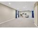 Spacious basement features neutral carpet, recessed lighting, and is decorated with stylish decor at 123 Wheat Ridge St, Palmer Lake, CO 80133