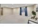 This spacious basement features neutral carpet, recessed lighting, and bright windows at 123 Wheat Ridge St, Palmer Lake, CO 80133