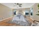 Bright bedroom with a ceiling fan and large windows with nice views at 123 Wheat Ridge St, Palmer Lake, CO 80133