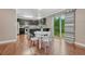 Modern kitchen with breakfast nook and sliding glass door to backyard at 123 Wheat Ridge St, Palmer Lake, CO 80133