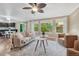 Open-concept living room flows into kitchen and dining area with natural light at 123 Wheat Ridge St, Palmer Lake, CO 80133