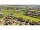 Aerial view of a home near a golf course, with green lawns and neighborhood streets at 23060 Hope Dale Ave, Parker, CO 80138