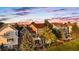 Backyard view of a home with a patio area, outdoor seating, and a lush yard at 23060 Hope Dale Ave, Parker, CO 80138