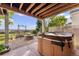 Backyard patio with hot tub, fire pit, swing, and view of the community at 23060 Hope Dale Ave, Parker, CO 80138