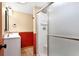 Bathroom featuring neutral walls, white cabinets, and a shower with glass door at 23060 Hope Dale Ave, Parker, CO 80138