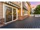 View of the deck featuring brick accents, a sliding glass door to the interior, and an awning at 23060 Hope Dale Ave, Parker, CO 80138