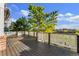 Spacious deck overlooking a green lawn and community with white railings and mature trees at 23060 Hope Dale Ave, Parker, CO 80138