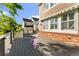 Spacious deck with awnings offering shade, complemented by brick accents and access to the house at 23060 Hope Dale Ave, Parker, CO 80138