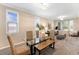 Bright dining room featuring a glass table, seating, and views to the living area at 23060 Hope Dale Ave, Parker, CO 80138