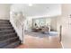 Inviting entryway with staircase leading to the main living area featuring lots of natural light at 23060 Hope Dale Ave, Parker, CO 80138