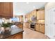 Spacious kitchen featuring wood cabinets, stainless appliances, and backyard view at 23060 Hope Dale Ave, Parker, CO 80138