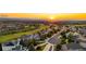 Scenic sunset view over a neighborhood near a golf course, highlighting community living at 23060 Hope Dale Ave, Parker, CO 80138